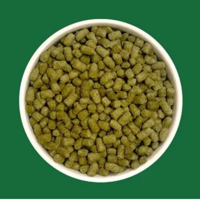 Bowl with green pellets, close-up of the food to show the shape and colour. Bowl with green pellets, close-up of the food to show the shape and colour.
