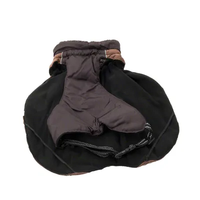Black dog coat with brown accents, adjustable straps and visible soft lining.