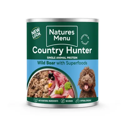 Natures Menu Country Hunter Wild Boar with Superfoods, single animal protein. With natural ingredients, no grain, hypoallergenic. Images of food and a curly-haired dog shown on label.