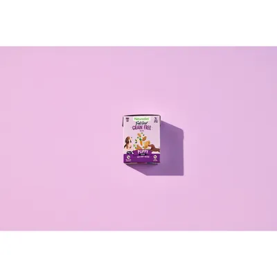 Box labelled 'Grain Free Puppy' with illustrations of animals and vegetables, highlighting grain-free formula for puppies. Key information: suitable for puppies, grain free.