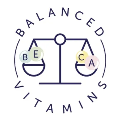 Texto en inglés: BALANCED VITAMINS. Dibujo de balanza con esferas que muestran BE, CA y A.