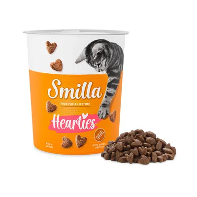 Smilla Hearties. Valmistettu Saksassa. Sisältää eläinproteiinia. Sydämenmuotoiset kissanherkut, oranssilla designilla varustettu pakkaus, jossa on kissan kuva.