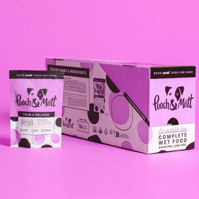 Pouch and box of Pooch & Mutt Calm & Relaxed complete wet food, grain free and junk free, for excitable dogs. Box contains 12x 100g packs. Feeding guide and ingredients visible.