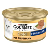 Purina Gourmet Gold Paté Fine con tacchino, cibo in lattina per gatti dorata con immagine di un gatto bianco e paté servito.
