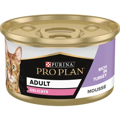 Purina Pro Plan Adult Delicate Mousse cat food tin, rich in turkey. Visible text: ADULT, DELICATE, RICH IN TURKEY, MOUSSE. Image of a cat on the label.