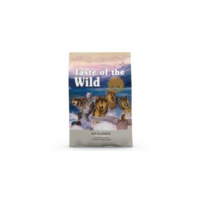 Confezione di crocchette Taste of the Wild Wetlands, testo visibile: 'Taste of the Wild', 'Wetlands', 'Grain-Free Diet'. Immagine con lupi e anatre su sfondo naturale.