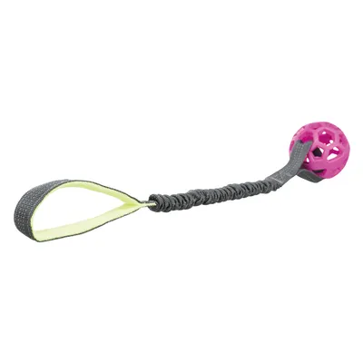 Leksak med rosa boll av plast, elastiskt grått band och gul ögla.
