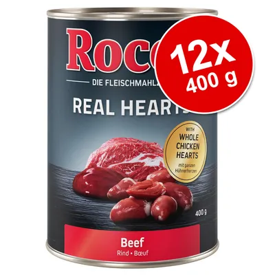 Rocco Real Hearts Beef, 12x400 g. Text: 'WITH WHOLE CHICKEN HEARTS', 'Beef Rind Bœuf', '400 g'. Bild på kött och hjärtan på burkens etikett.