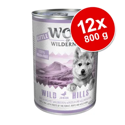 Little Wolf of Wilderness Wild Hills Junior, 12x800 g burkar. Text: 100% grain-free, anka & kalv med skogsbär, rötter och vilda örter. Bild på bergslandskap.