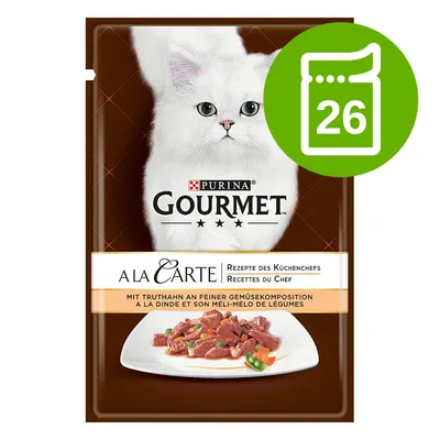 Purina Gourmet A la Carte, opakowanie z białym kotem, widoczny napis: Rezepte des Küchenchefs, 26 saszetek w zestawie, ilustracja dania z mięsem i warzywami.