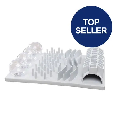 Weißes interaktives Spielzeug mit verschiedenen Elementen: transparente Kugeln, Stäbchen, Wellen und Tunnel. Blauer Kreis mit Text 'Top Seller'.