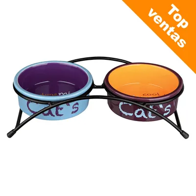 Dos cuencos de cerámica para gatos con soporte metálico, uno azul y otro naranja. Texto visible: "Cat's". Etiqueta en la esquina: Top ventas.