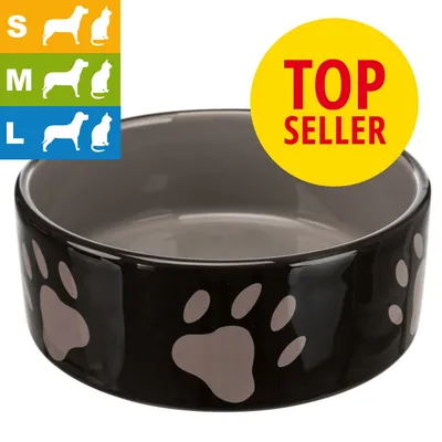 Keraaminen musta ruokakuppi tassukuvioilla, koot S, M ja L. Keltainen merkintä: TOP SELLER. Vasemmalla kokoluokat koiralle ja kissalle kuvakkein.