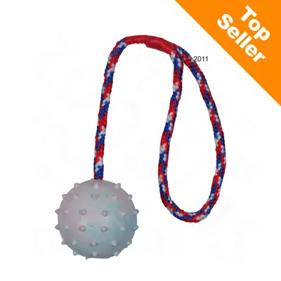 Nystyräpintainen pallo, jossa punasinivalkoinen naru. Oranssi kulma: Top Seller. Nystyräpintainen pallo, jossa punasinivalkoinen naru. Oranssi kulma: Top Seller.