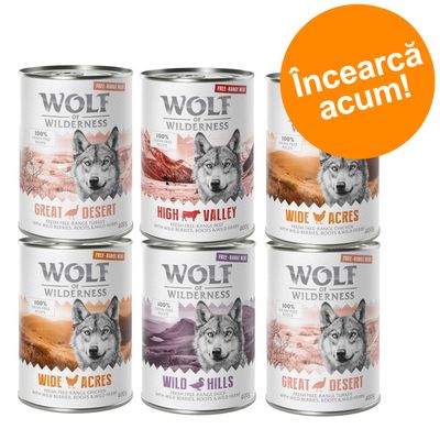 6 conserve Wolf of Wilderness: Great Desert, High Valley, Wide Acres, Wild Hills. Text portocaliu: Încearcă acum! Fiecare conservă 400g, carne de curcan, vită, pui sau rață.