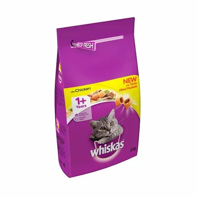 Whiskas 2kg cat food with chicken, for cats 1+ years. Visible text: NEW with Tasty Filled Pockets, Complete & Healthy Teeth, ZIP FRESH. Purple bag with cat image.