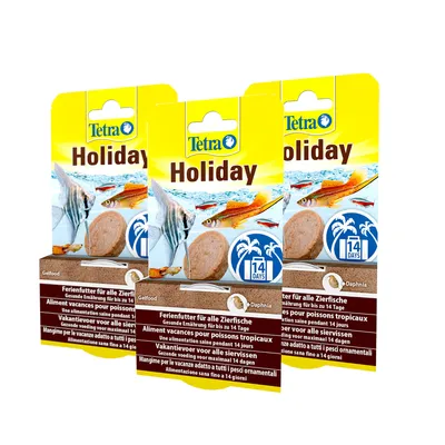 Tetra Holiday. Ferienfutter für alle Zierfische, gesunde Ernährung bis zu 14 Tage. Gelfood mit Daphnia. Verpackung zeigt tropische Fische und Symbol für 14 Tage. Tetra Holiday. Ferienfutter für alle Zierfische, gesunde Ernährung bis zu 14 Tage. Gelfood mit Daphnia. Verpackung zeigt tropische Fische und Symbol für 14 Tage.