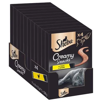 Sheba Creamy Snacks met kip, verpakking van 11 x 4 stuks à 12 g, afbeelding van kat en snack, tekst: 'mit Huhn au poulet', merknaam Sheba duidelijk zichtbaar.