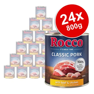 Rocco Classic Pork with beef & chicken, 24 x 800g tins. Label shows 100% fresh ingredients & grain-free recipe. Large can in front, stacked cans behind. Red badge: 24x 800g.