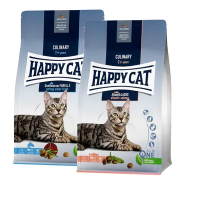 To poser Happy Cat Culinary 1+ years kattefoder. Varianter: QuellwasserFORELLE spring water trout og AtlantikLACHS atlantic salmon. Billede af kat, synlige foderpiller og ingredienser.