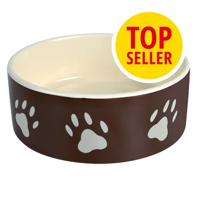 Keramická miska hnědé barvy s bílými otisky tlapek, žlutý kruh s červeným textem TOP SELLER v pravém horním rohu