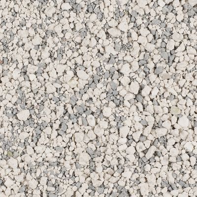 Lettiera per gatti composta da granuli bianchi e grigi, vista ravvicinata del materiale senza confezione o marchio visibile.