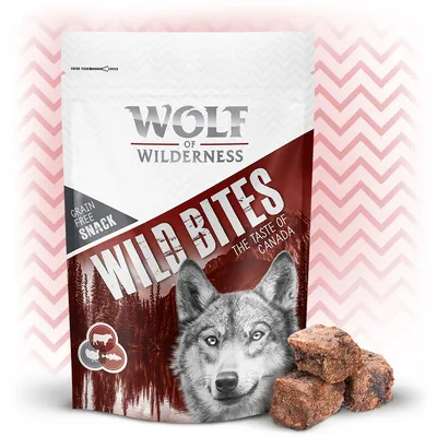 Wolf of Wilderness Wild Bites The Taste of Canada, snack senza cereali. Confezione con immagine di lupo e cubetti di snack visibili accanto alla busta.