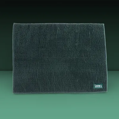 Dark green mat with microfibre texture, rectangular, 'kooa' brand logo visible at bottom right.