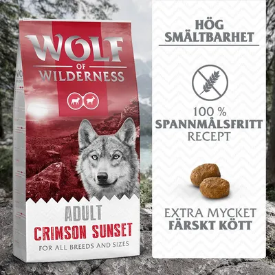 Wolf of Wilderness Adult Crimson Sunset hundfoder. Text: Hög smältbarhet, 100 % spannmålsfritt recept, extra mycket färskt kött. Bild på två foderbitar.