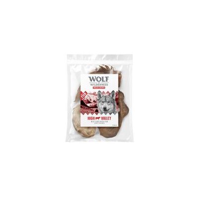 Sachet de friandises Wolf Wilderness High Valley, visible texte : 100 % bœuf, 120 g. Emballage transparent montrant des morceaux de viande séchée.