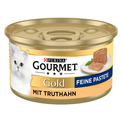 Purina Gourmet Gold Fin Paté med kalkon, kattmat i en gyllene burk med bild av en vit katt och serverad paté.