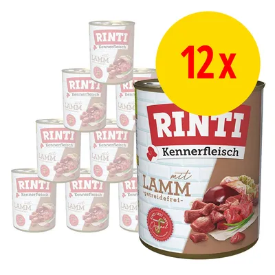 Lot de 12 boîtes Rinti Kennerfleisch mit Lamm getreidefrei, visuel avec morceaux de viande et légumes sur l’étiquette. Texte en allemand visible. Lot de 12 boîtes Rinti Kennerfleisch mit Lamm getreidefrei, visuel avec morceaux de viande et légumes sur l’étiquette. Texte en allemand visible.