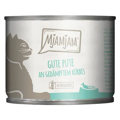 Boîte de nourriture pour chat MjAMjAM, texte visible : Gute Pute an gedämpftem Kürbis, Getreidefrei. Illustration de chat et gamelle sur l’étiquette.