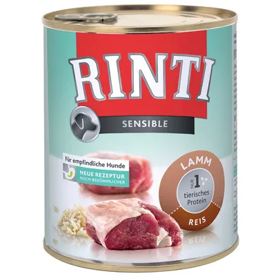RINTI Sensible dåse med teksten 'Für empfindliche Hunde', 'Neue Rezeptur noch bekömmlicher', 'Lamm', 'Reis', 'nur 1 tierisches Protein'. Billede af kød og ris på etiketten.
