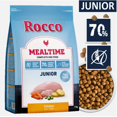 Rocco Mealtime Junior Chicken, 1 kg. Widoczne: 70% składników zwierzęcych, bez zbóż, bogata w świeżego kurczaka. Opakowanie oraz granulat karmy.