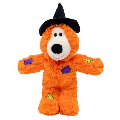 KONG Knots peluche arancione con cappello da strega, funzione squeak, cuciture visibili. La confezione mostra il logo KONG Knots e un motivo di Halloween.