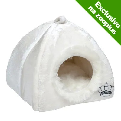 Cama tipo tenda em pelúcia branca com entrada circular e coroa bordada. Texto visível: Exclusivo na zooplus.