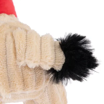 Plush toy with beige fabric body and black, fluffy tail.