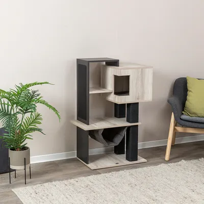 Modern wooden cat tree with multiple levels, cave and hammock. Black scratching surfaces on the posts. Suitable for cats for playing and relaxing.