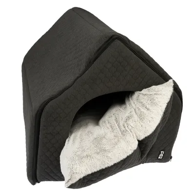 Dark grey pet house with soft white plush padding and quilted fabric design. Visible logo: TIAKI.
