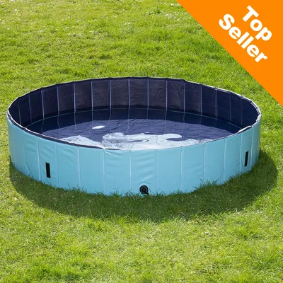 Rond blauw zwembad van kunststof, gevuld met water, op grasveld. Oranje hoeklabel met witte tekst: Top Seller.