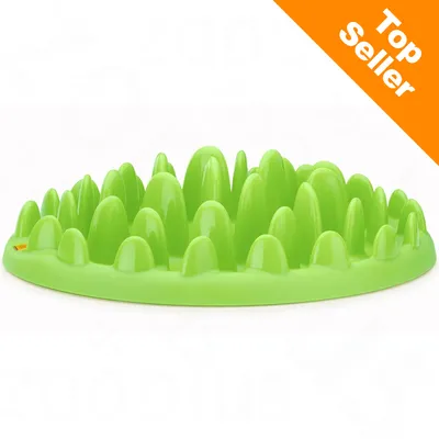 Groene voerbak van plastic met verhoogde bulten, oranje hoeklabel met witte tekst: Top Seller