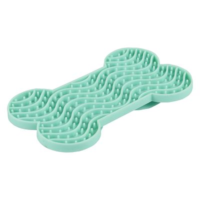 Benformad, mintgrön silikonmatta med vågstruktur och små knoppar, lämplig för långsam ätning eller sysselsättning.