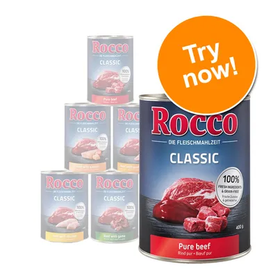 Rocco Classic Pure beef 400g tin, visible text: 100% fresh ingredients & grain-free. Other Rocco Classic flavours in background. Orange badge reads: Try now!