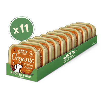 Pack of 11 trays labelled Organic Chicken Supper with carrot and peas, displayed in green box marked proper food for dogs. Brand name Lily's Kitchen visible.