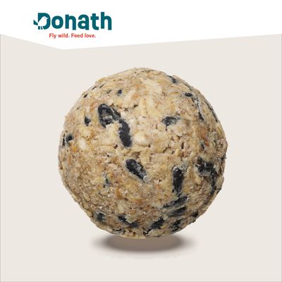 Boule de nourriture pour oiseaux Donath, mélange compact de graines et matières grasses, logo Donath visible en haut avec le texte Fly wild. Feed love.