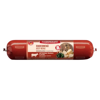 Fleischeslust Rindermenü Beef Menu, aliment complet avec panais, noisette et algue. Texte en anglais et allemand visible sur l’emballage. Saucisse emballée sous vide.