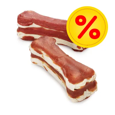 Twee kauwbotten met rood-witte lagen, gele kortingsbadge met rood procentteken zichtbaar rechtsboven op de afbeelding.