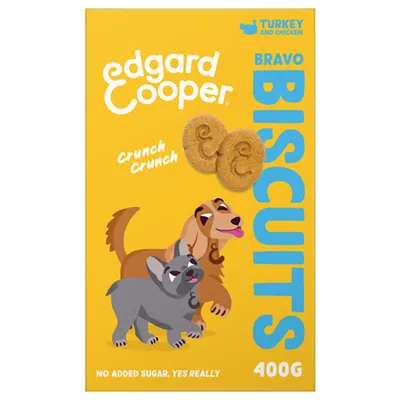 Edgard Cooper Bravo Biscuits, kalkoen en kip, 400g. Crunch Crunch. Geen toegevoegde suiker. Twee hondenillustraties op gele verpakking, twee ronde koekjes met 'e'.
