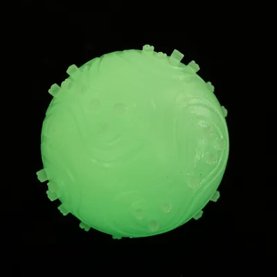 Green ball with textured surface and small bumps, suitable for play activities. Green ball with textured surface and small bumps, suitable for play activities.
